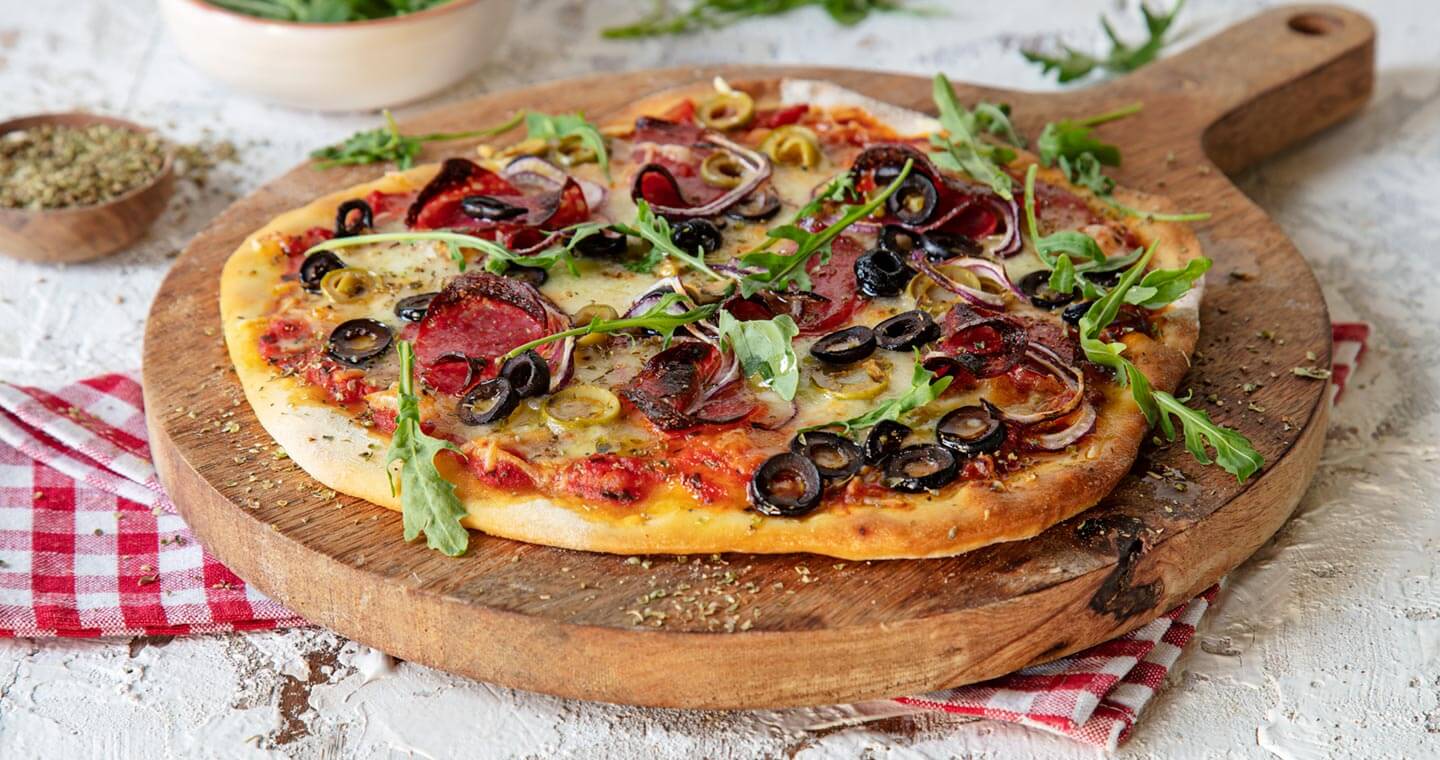 Olive And Salami Pizza With Arugula Gallo